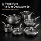 A 6-piece titanium cookware set arranged on a dark surface against a black background, with white and orange text at the top reading '6-Piece Pure Titanium Cookware Set' and 'Built for Everyday Cooking.' The set includes multiple stainless-steel pots, pans, and lids with visible brushed metal finishes and glass lids.