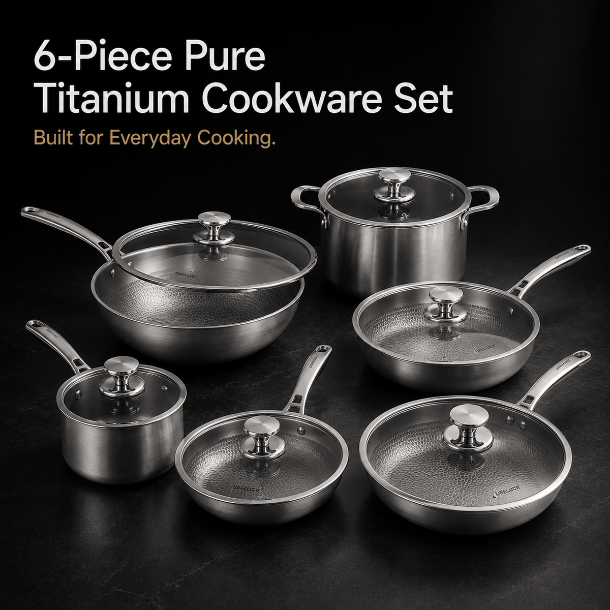 A 6-piece titanium cookware set arranged on a dark surface against a black background, with white and orange text at the top reading '6-Piece Pure Titanium Cookware Set' and 'Built for Everyday Cooking.' The set includes multiple stainless-steel pots, pans, and lids with visible brushed metal finishes and glass lids.