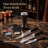 A set of kitchen knives with dark wood handles and patterned steel blades arranged on a dark marble countertop, alongside a black cylindrical tool, a black rectangular accessory, and small round metal pieces. The scene is styled in a kitchen with bottles and copper pots in the background, and the text 'One Solution for Every Knife' appears in the upper left.