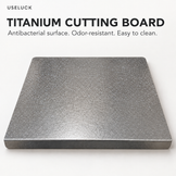 A square titanium cutting board with a textured metallic gray surface, shown on a clean white background with promotional text at the top.